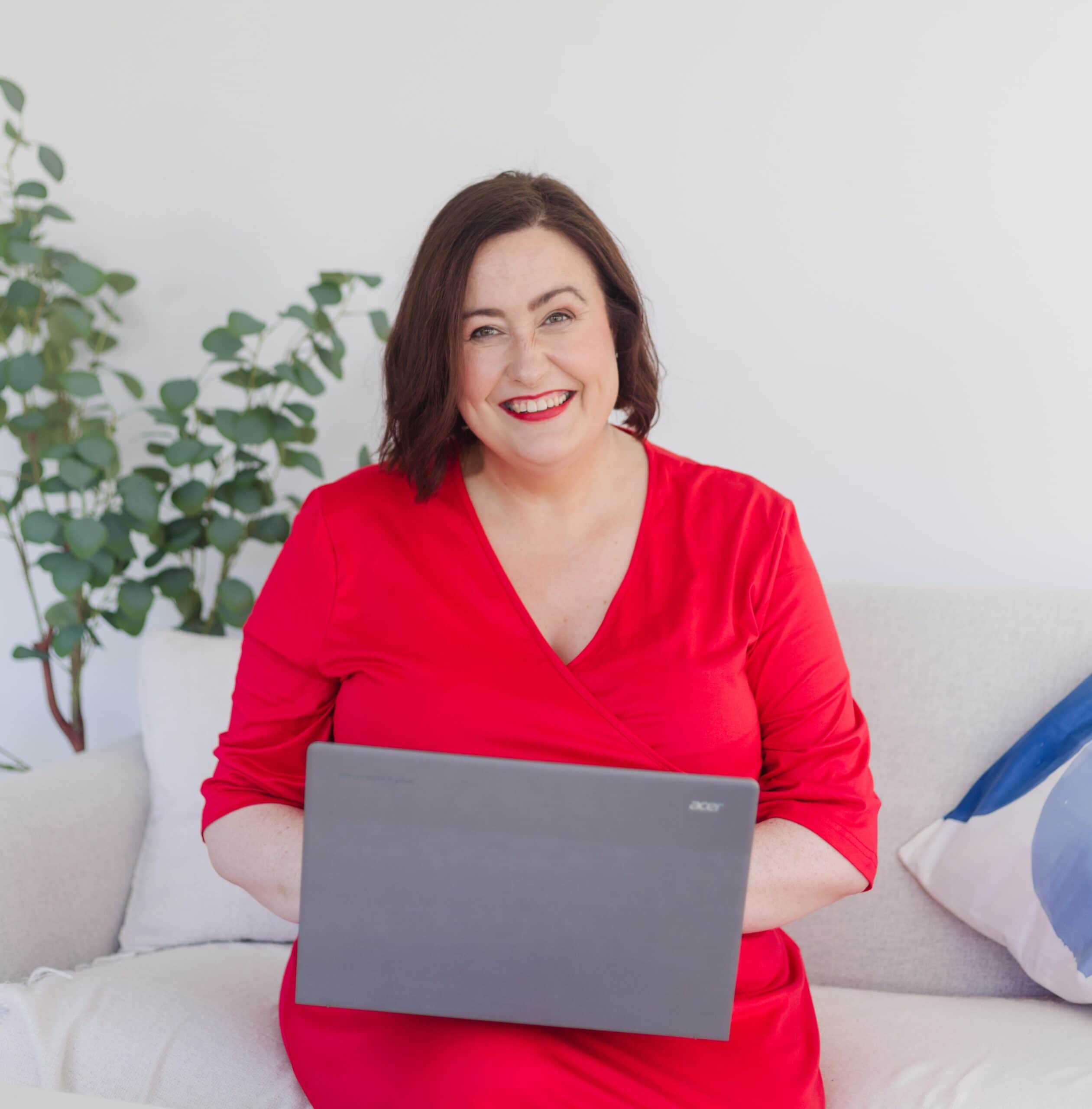 Woman working on a laptop at home, representing consulting services.